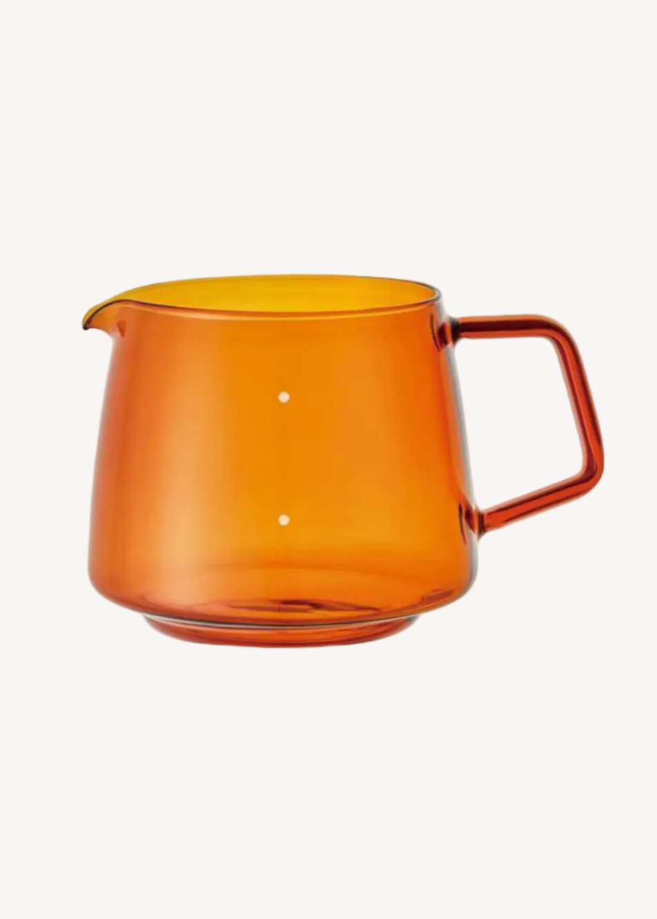 Orange glass pitcher with a handle on a white background