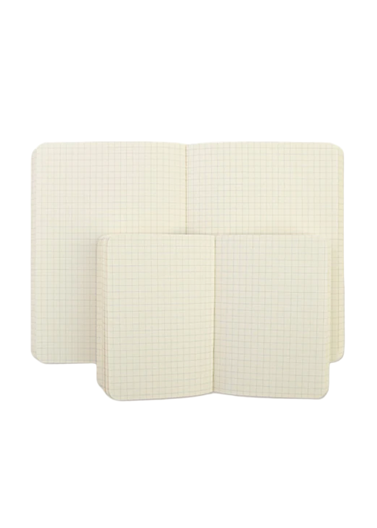 Two white notebooks with gridded lines on a white background