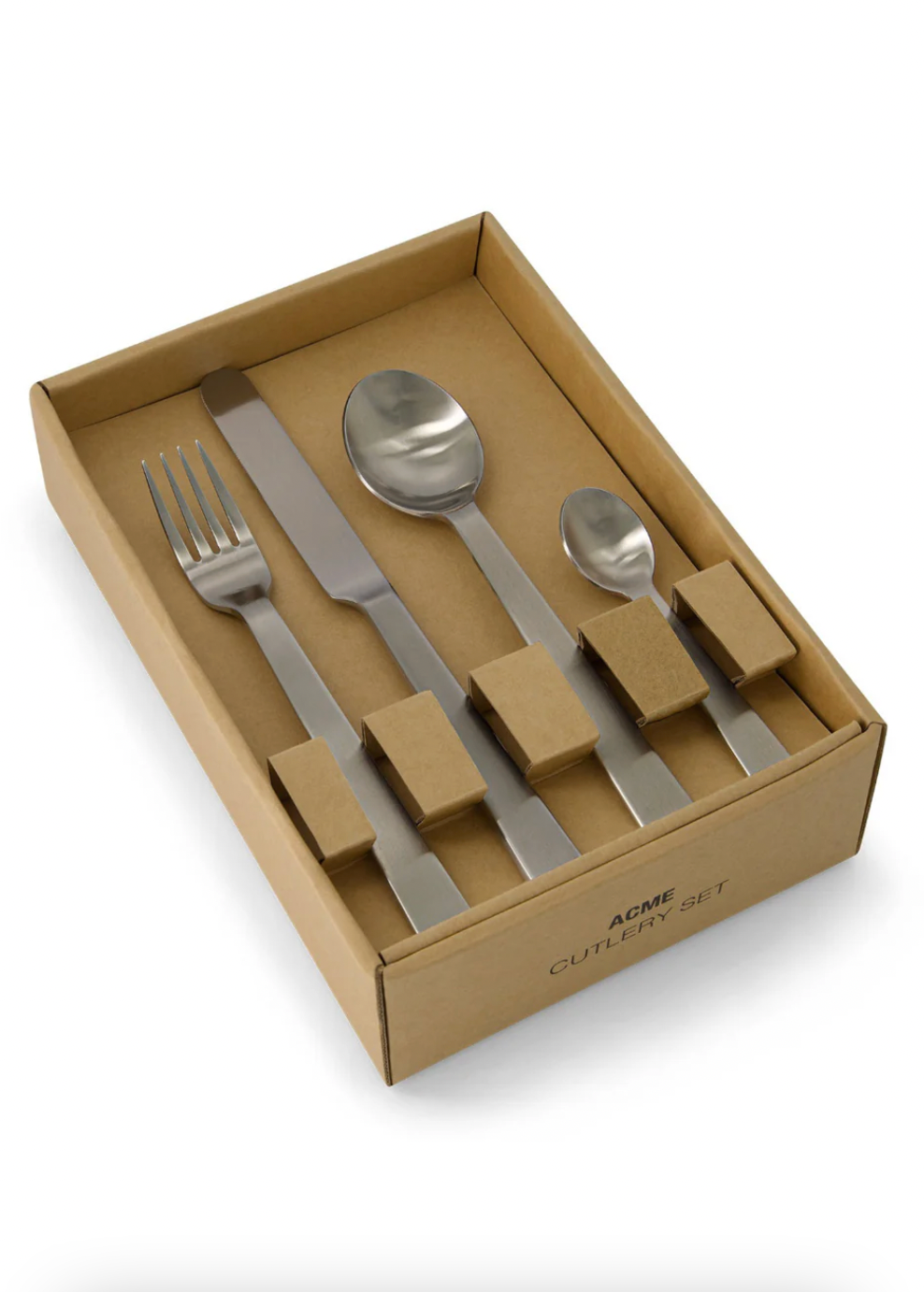 Set of silver cutlery in a cardboard box on a white background