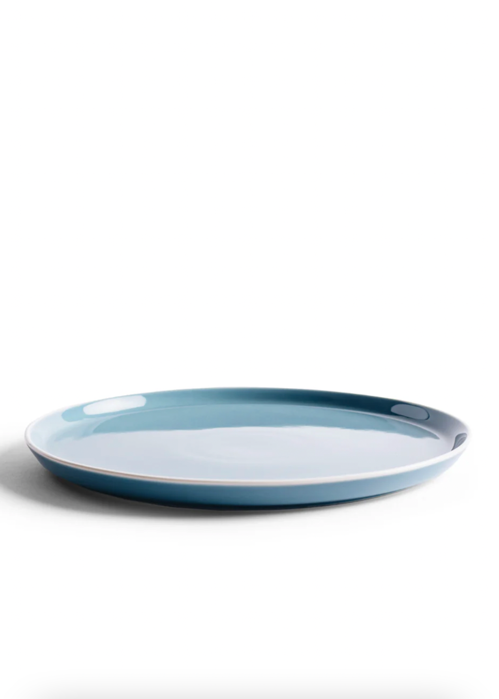Blue ceramic plate on a white background