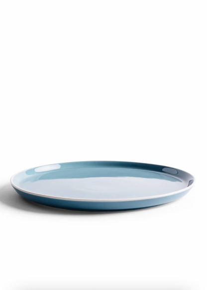 Blue ceramic plate on a white background
