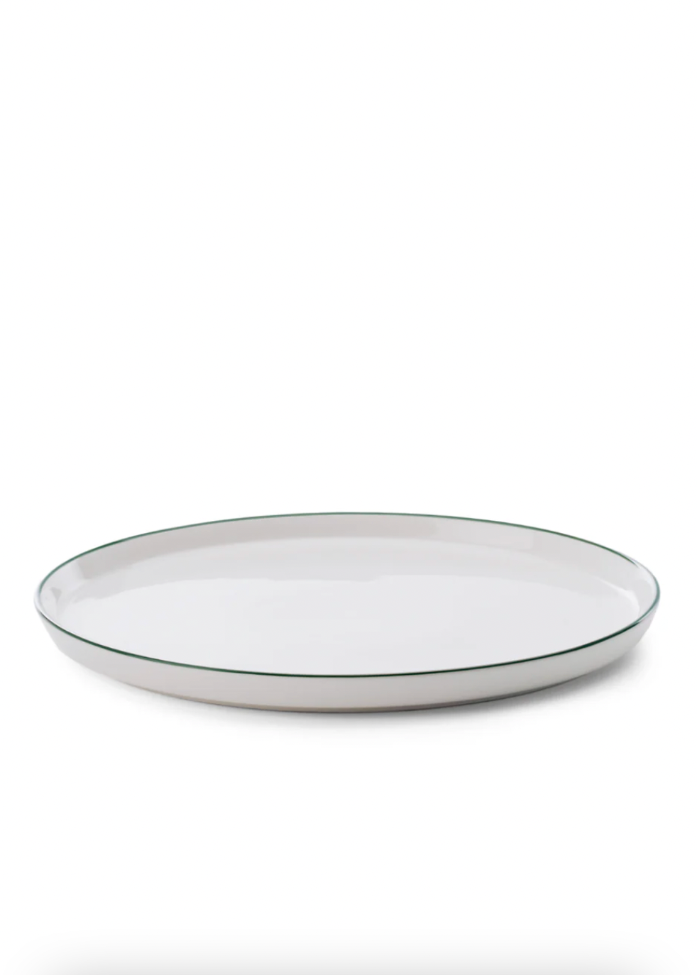 White ceramic plate with a thin black rim on a white background