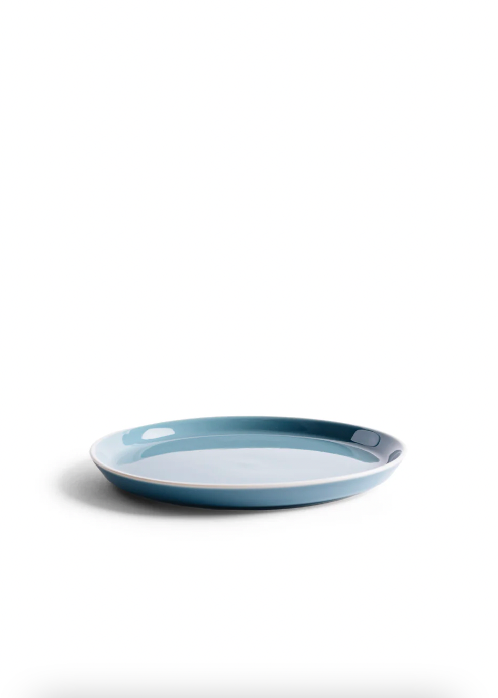 Blue ceramic plate on a white background