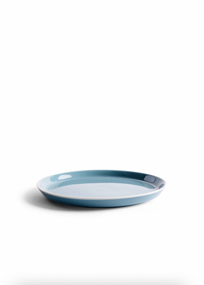 Blue ceramic plate on a white background