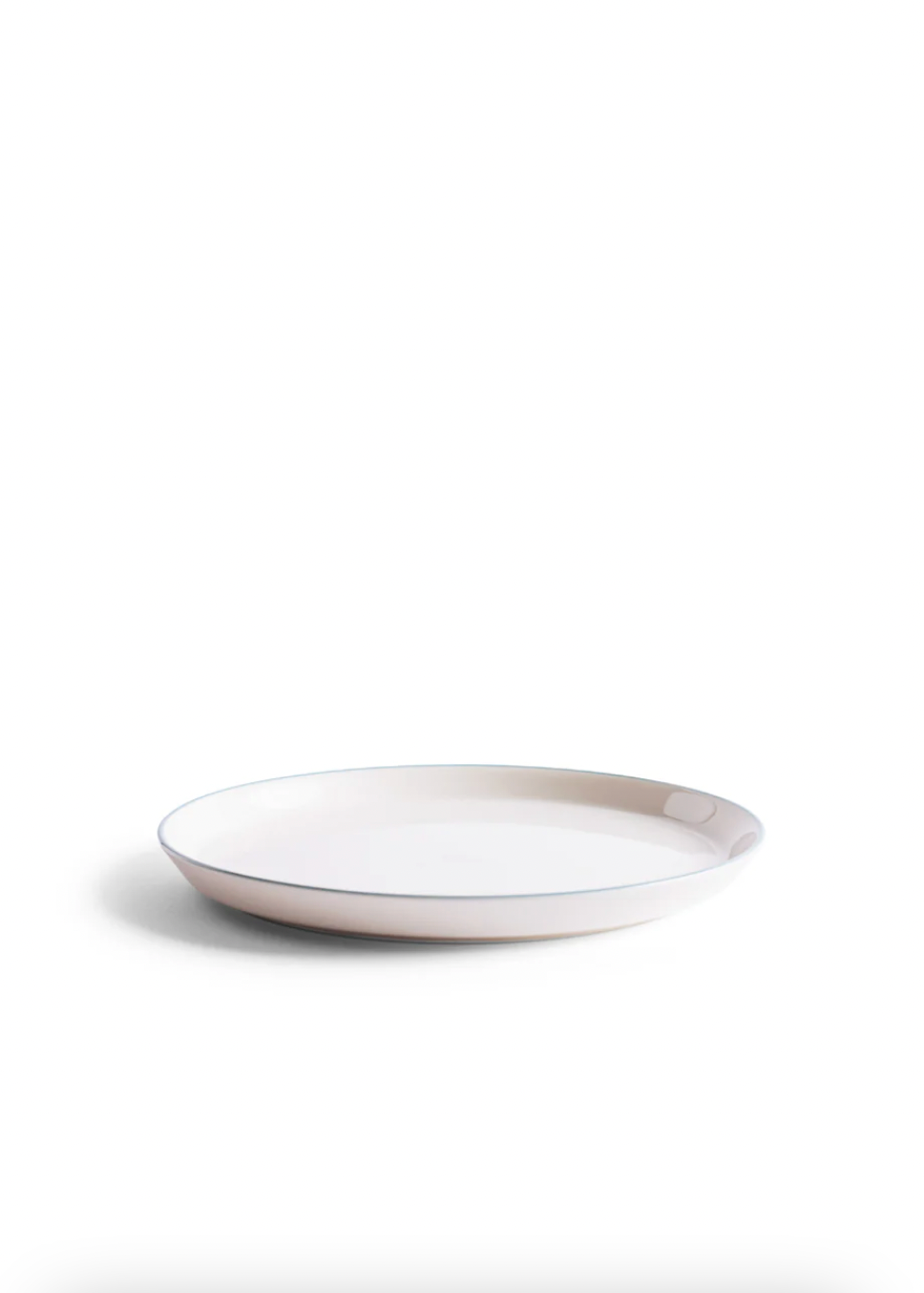 White ceramic plate on a white background