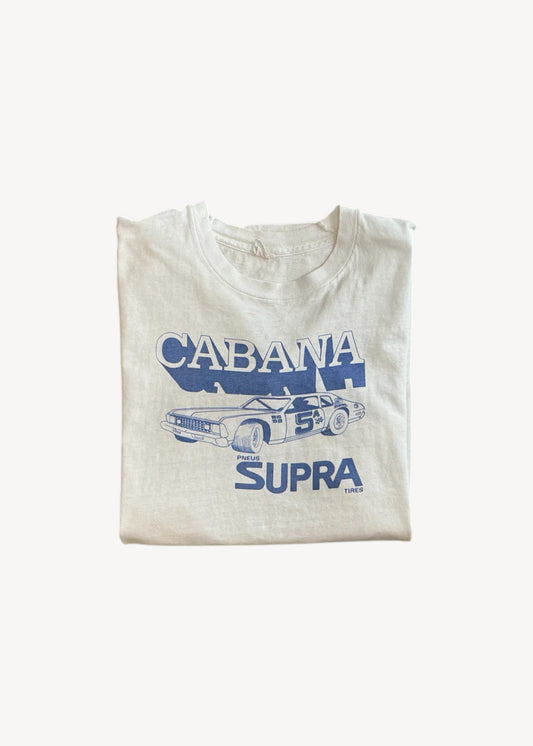 Folded t-shirt with 'Cabana Supra' graphic design on a white background