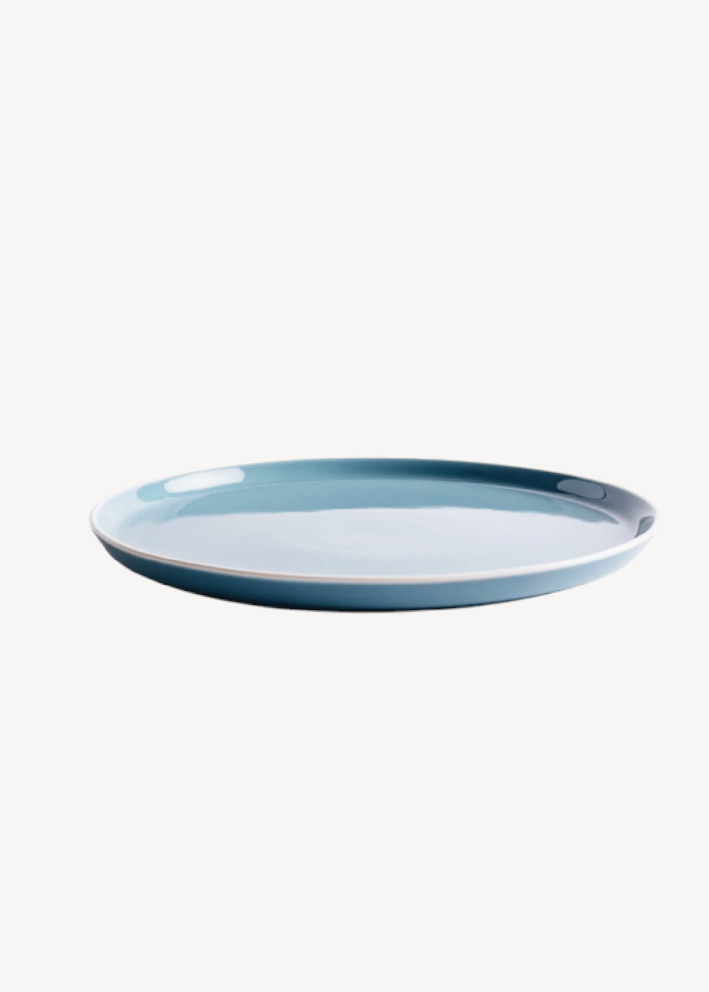 Blue ceramic plate on a white background