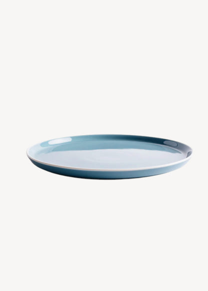 Blue ceramic plate on a white background