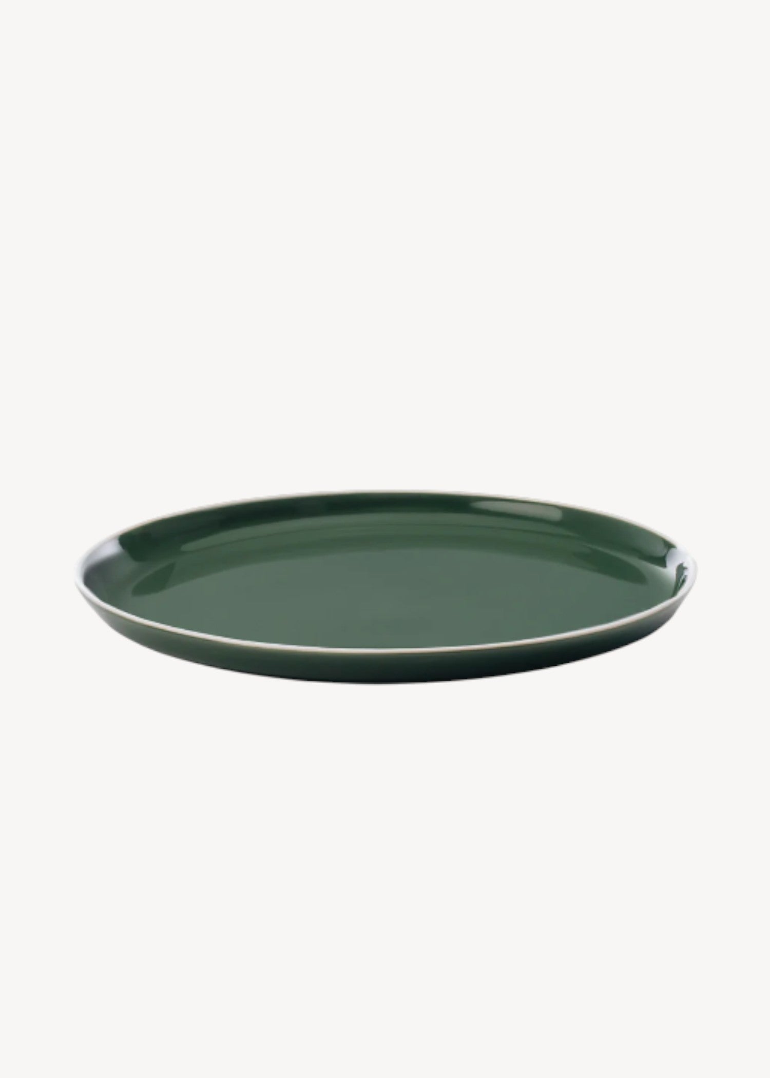 Green ceramic plate on a white background