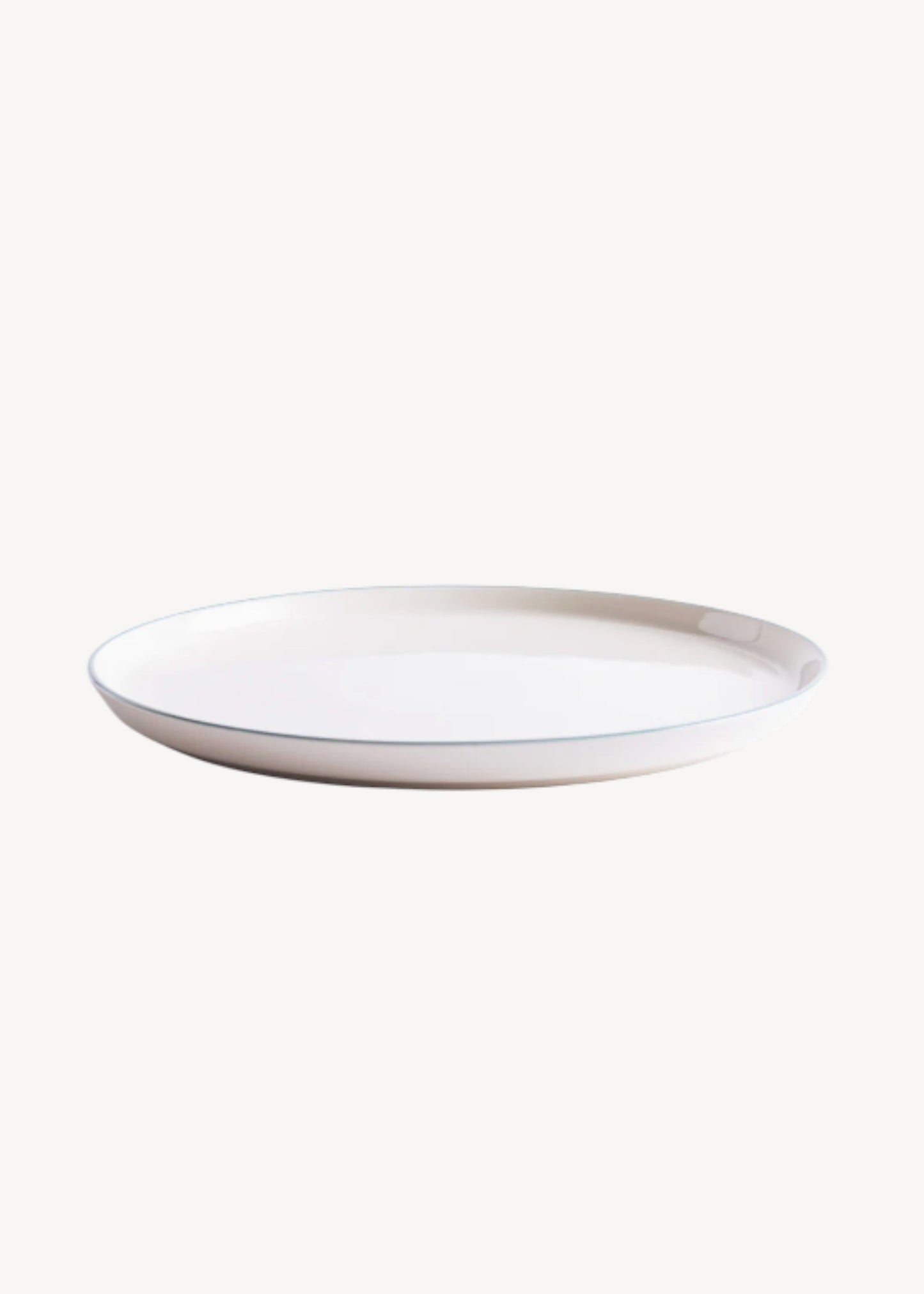 White ceramic plate on a white background
