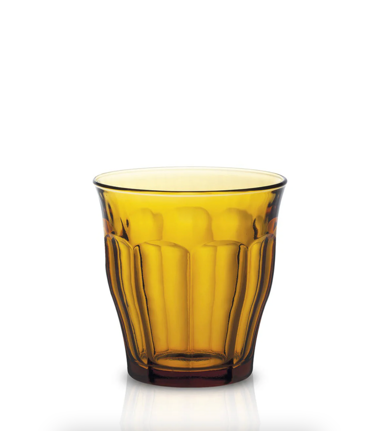 Yellow glass tumbler on a white background