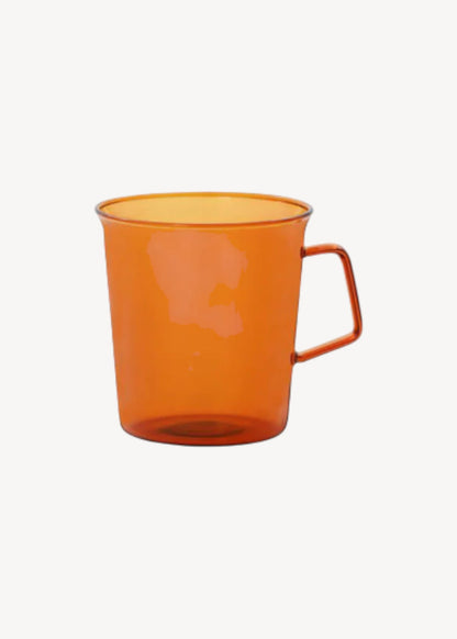 Orange mug on a white background