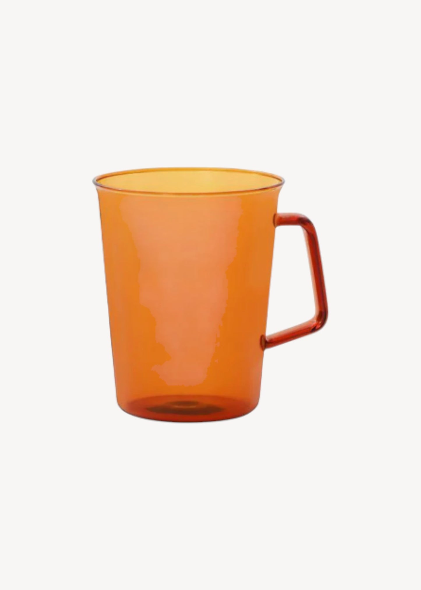 Orange mug with a handle on a white background