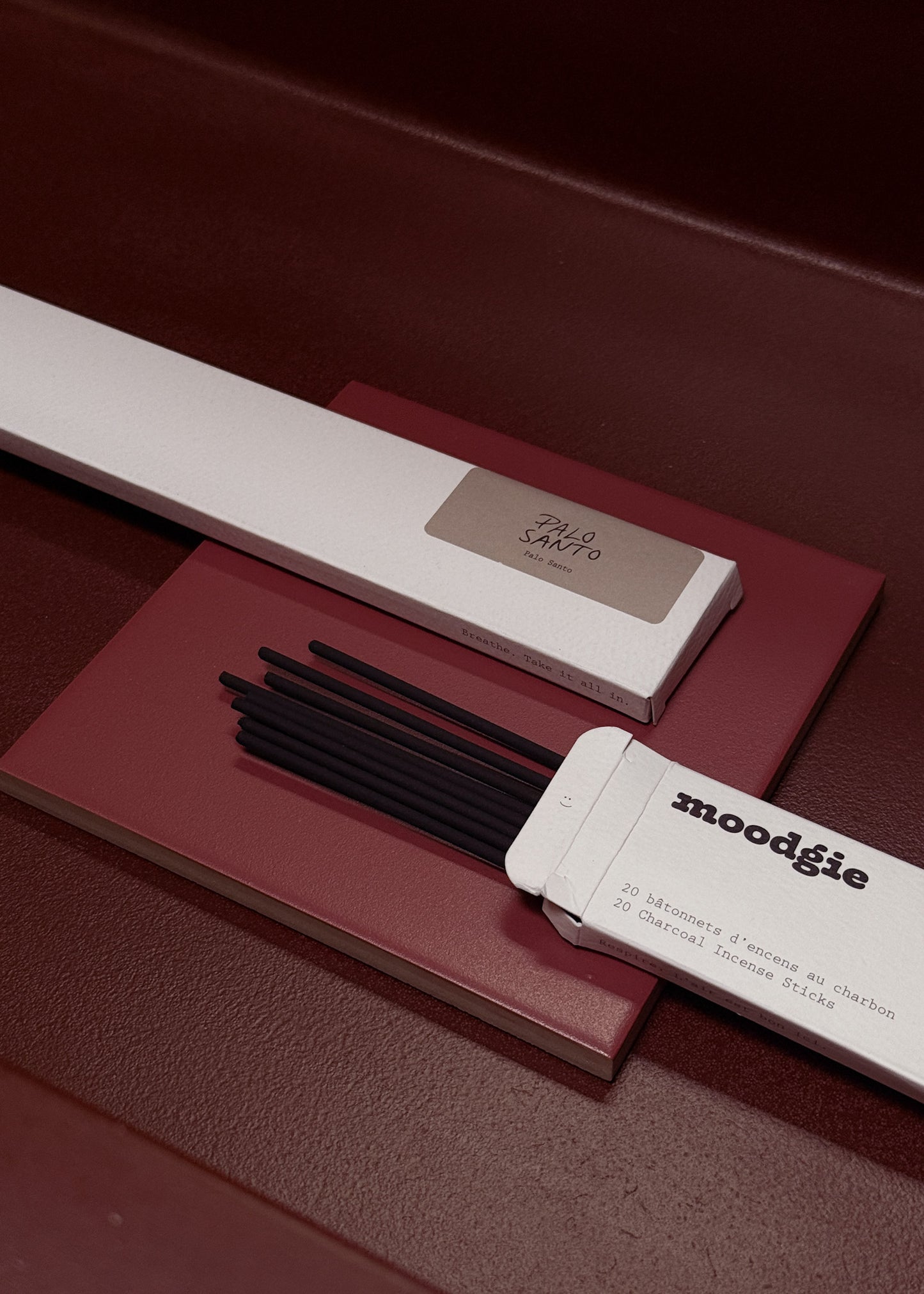 Moodgie incense sticks with packaging on a dark surface