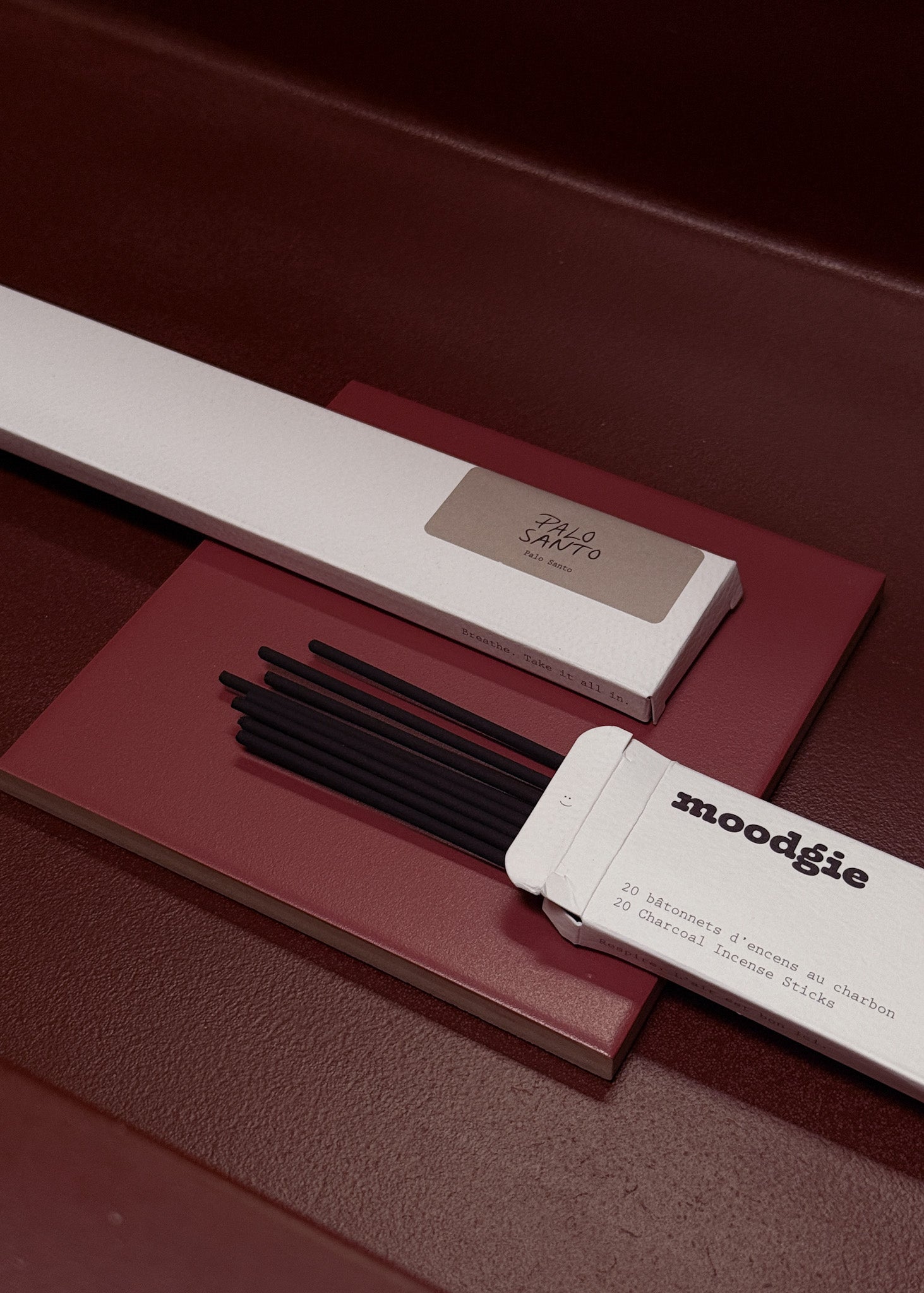 Moodgie incense sticks with packaging on a dark surface