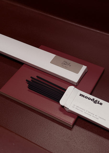 Moodgie incense sticks with packaging on a dark surface