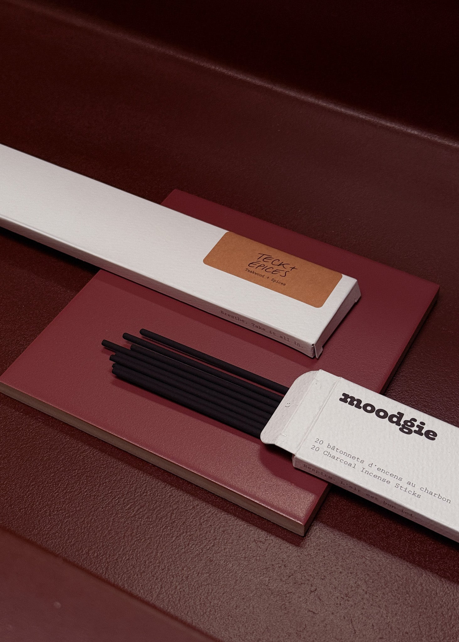 Moodgie incense sticks with packaging on a dark surface