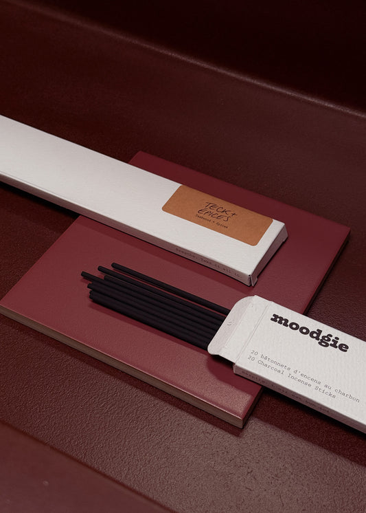 Moodgie incense sticks with packaging on a dark surface