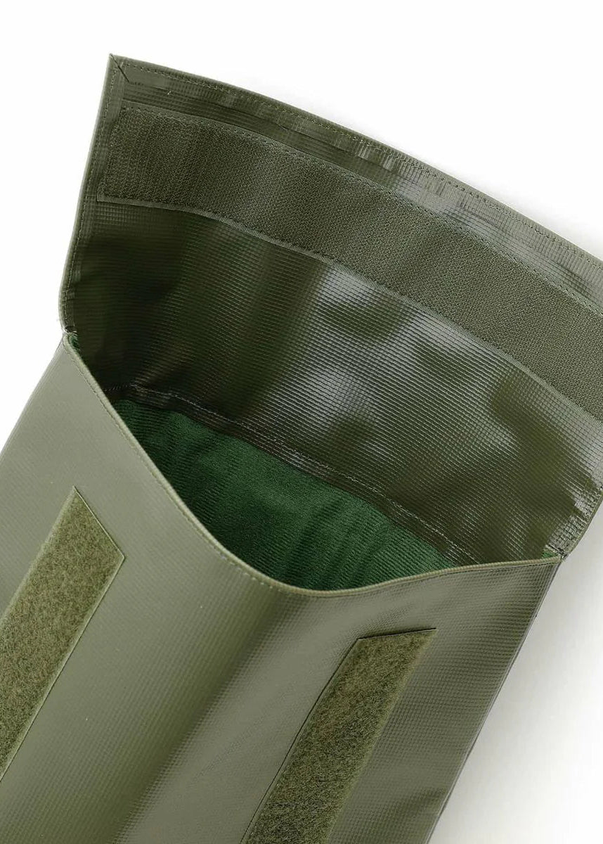 Open green laptop case with velcro closure on a white background