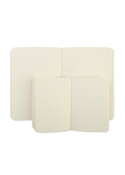Two white notebooks with gridded lines on a white background