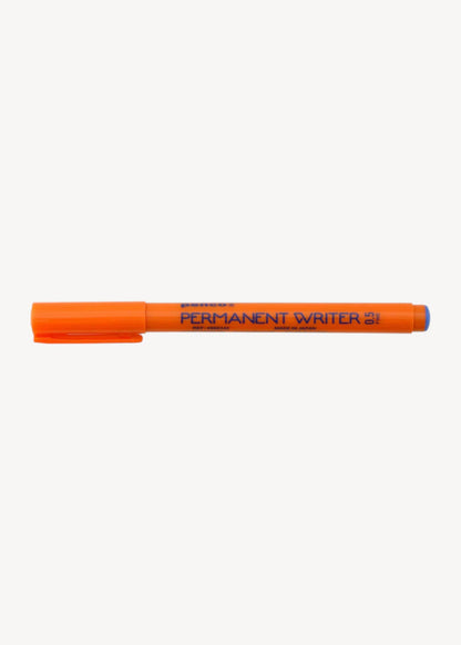 Orange permanent marker on a white background