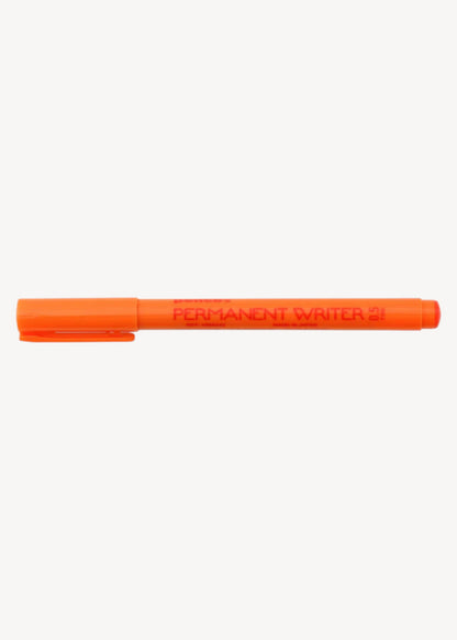 Orange permanent marker on a white background