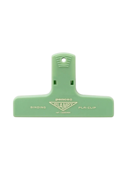 Green binding clip with 'Penco' branding on a white background