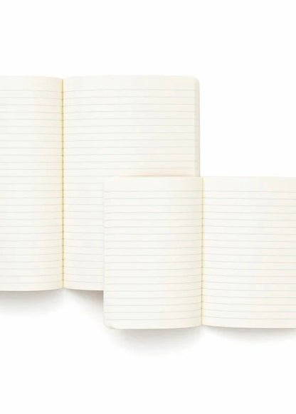 Close-up of a notebook with lined pages on a white background