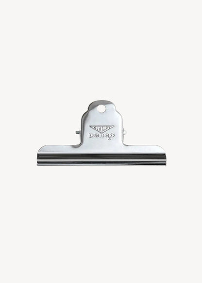 Metallic clip with a brand logo on a white background
