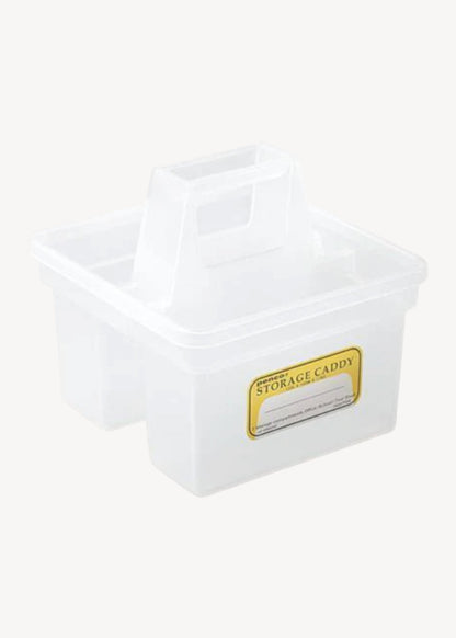 White storage caddy with a gold label on a white background