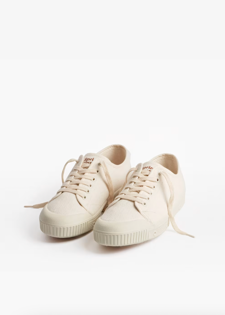 Pair of white sneakers on a white background