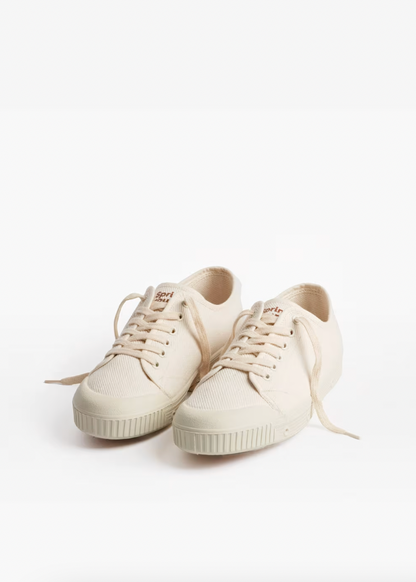 Pair of white sneakers on a white background