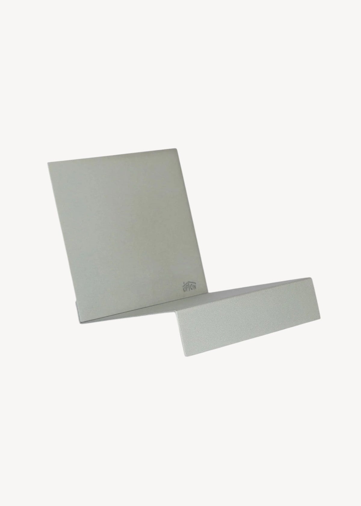 Two metallic sheets on a white background